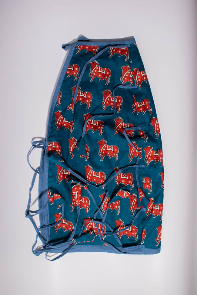 Blue fabric with red patterns on a white background